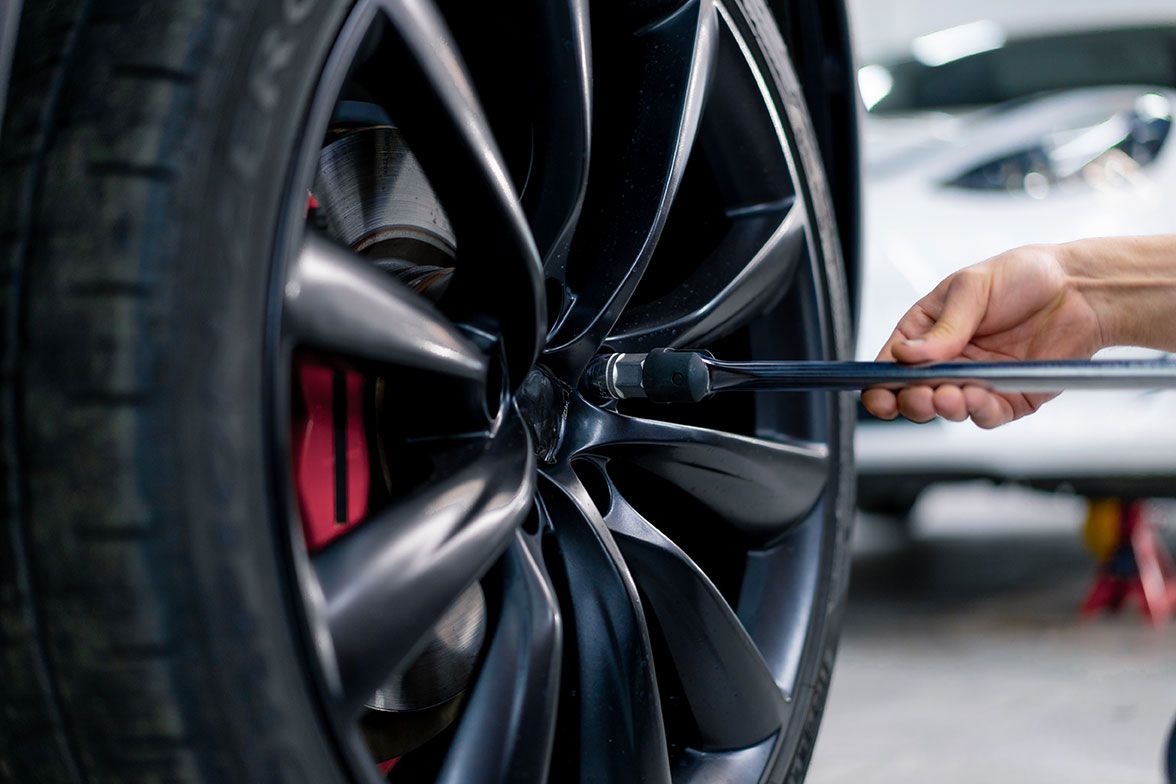 auto-mechanic-man-changing-a-wheel